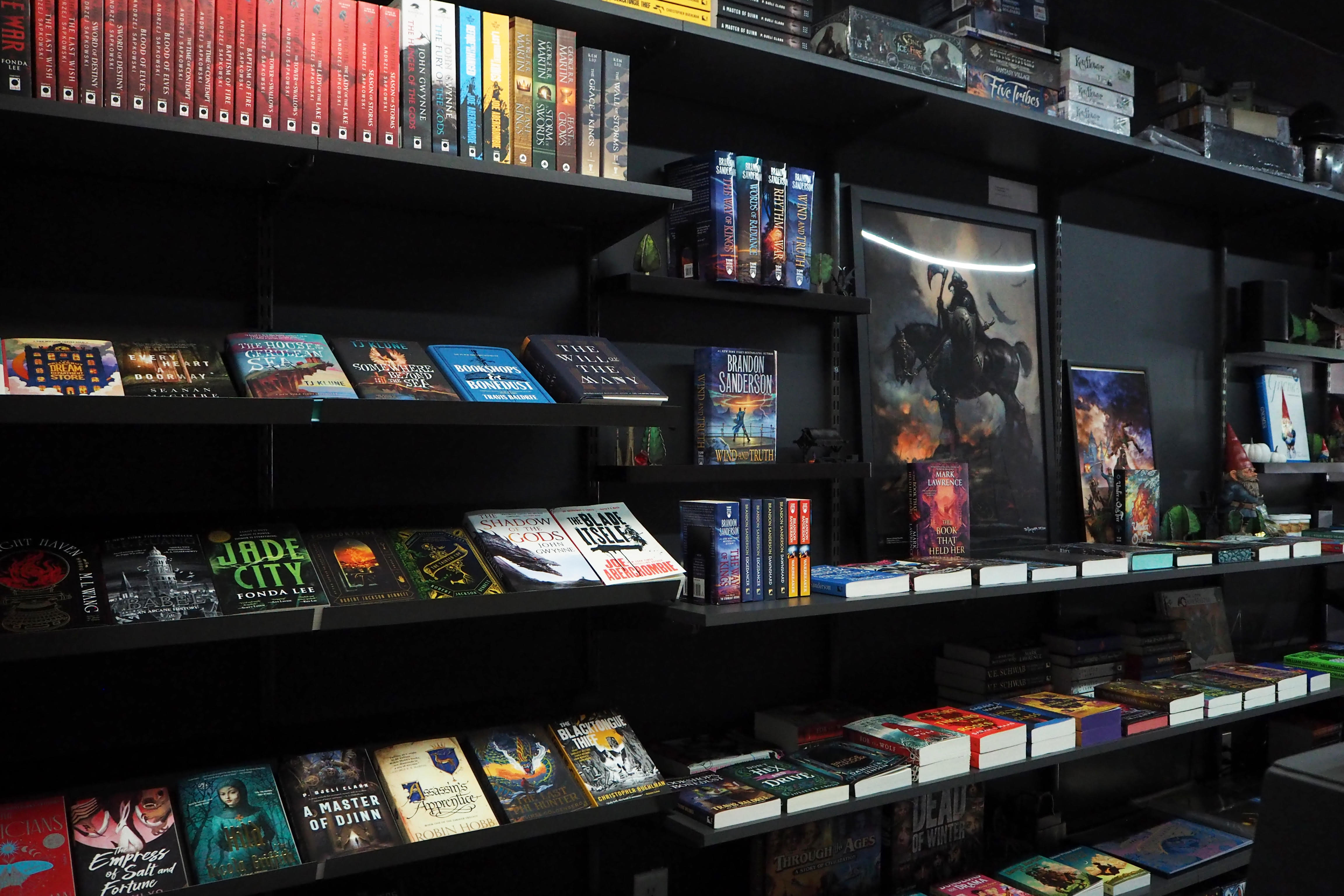 Shelves of sci-fi and fantasy novels and RPG books inside Dungeon Books